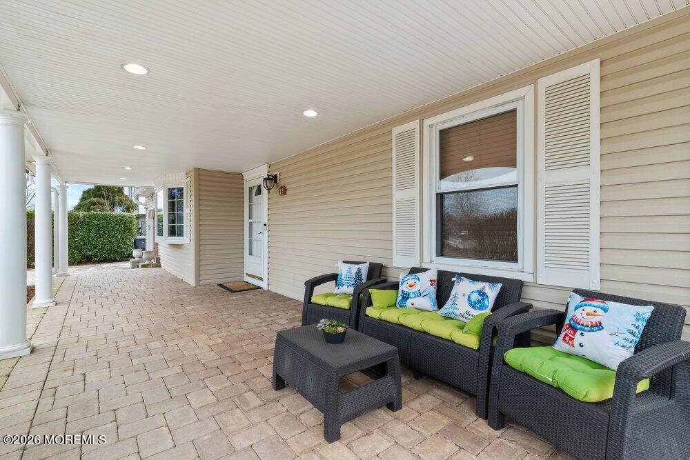 39 Cypress Road Toms River, NJ 08753 - Photo 7 of 52 a outdoor living space with furniture and a window