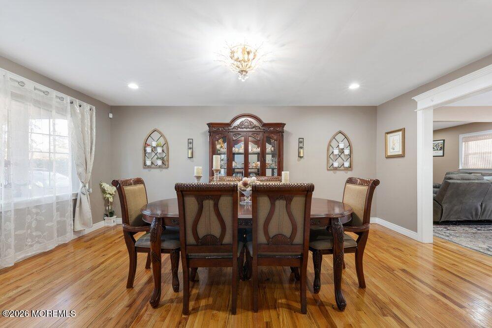 39 Cypress Road Toms River, NJ 08753 - Photo 10 of 52 a view of a dining room with furniture window and wooden floor