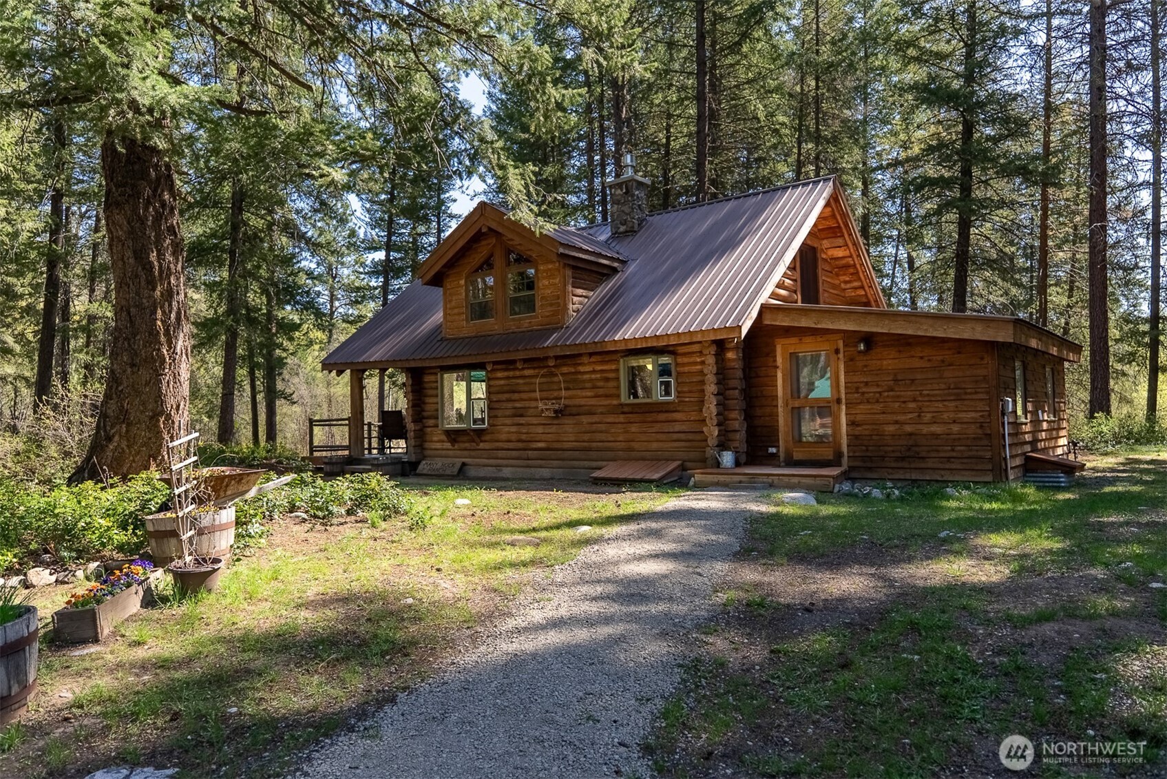 583 B Twisp River Road Twisp, WA 98856 - Photo 5 of 39 a front view of a house with a yard
