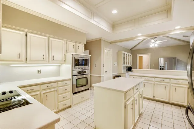 a kitchen with stainless steel appliances a stove a sink and a refrigerator