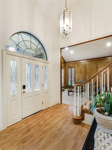 a view of an entryway with wooden floor