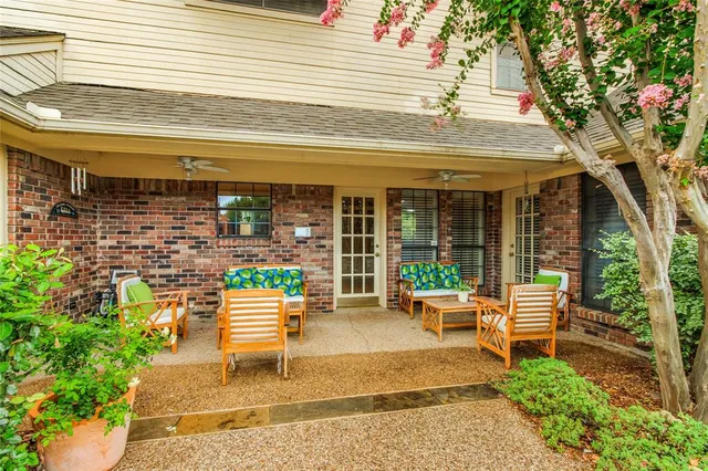a chair and table sitting in front of a building