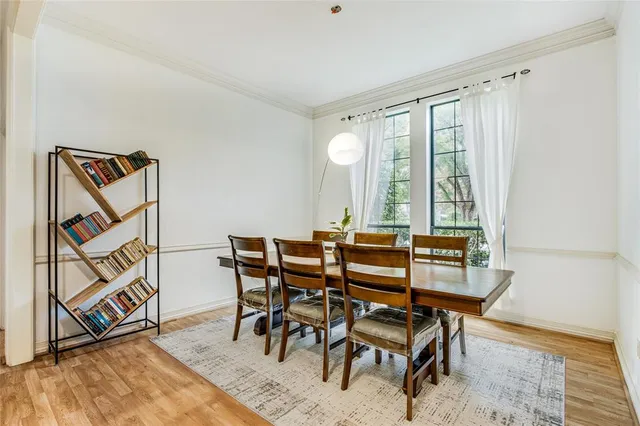 a view of a dining room with furniture and a window