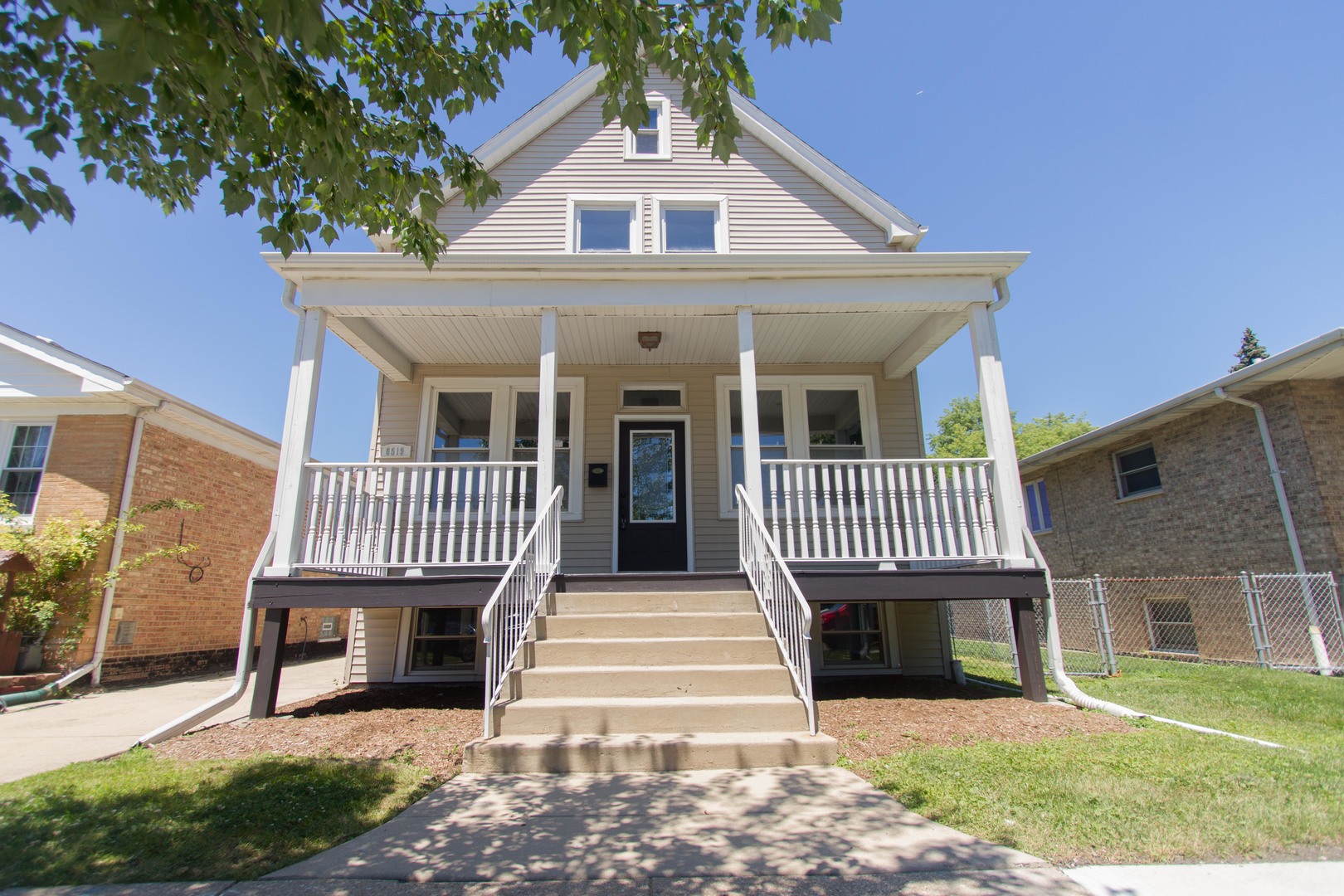 6519 28th Street Berwyn, IL 60402 - Photo 1 of 28 a front view of a house with a yard