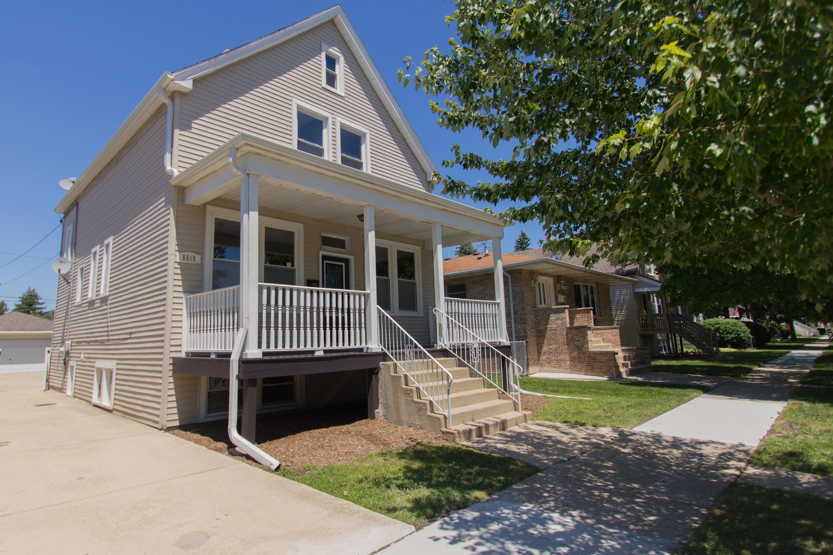 6519 28th Street Berwyn, IL 60402 - Photo 2 of 28 a front view of a house with a yard