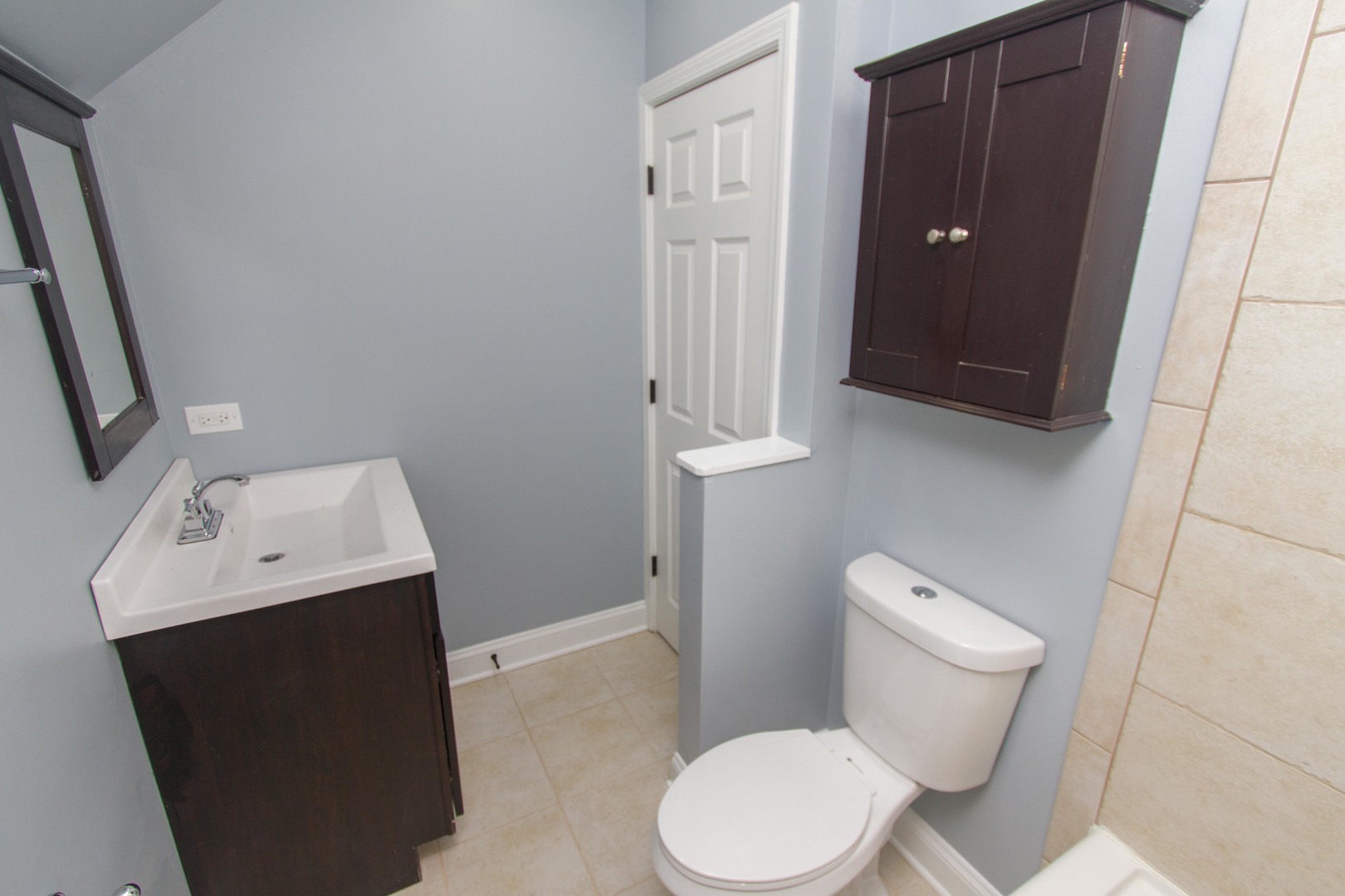 6519 28th Street Berwyn, IL 60402 - Photo 19 of 28 a white toilet sitting next to a bathroom sink