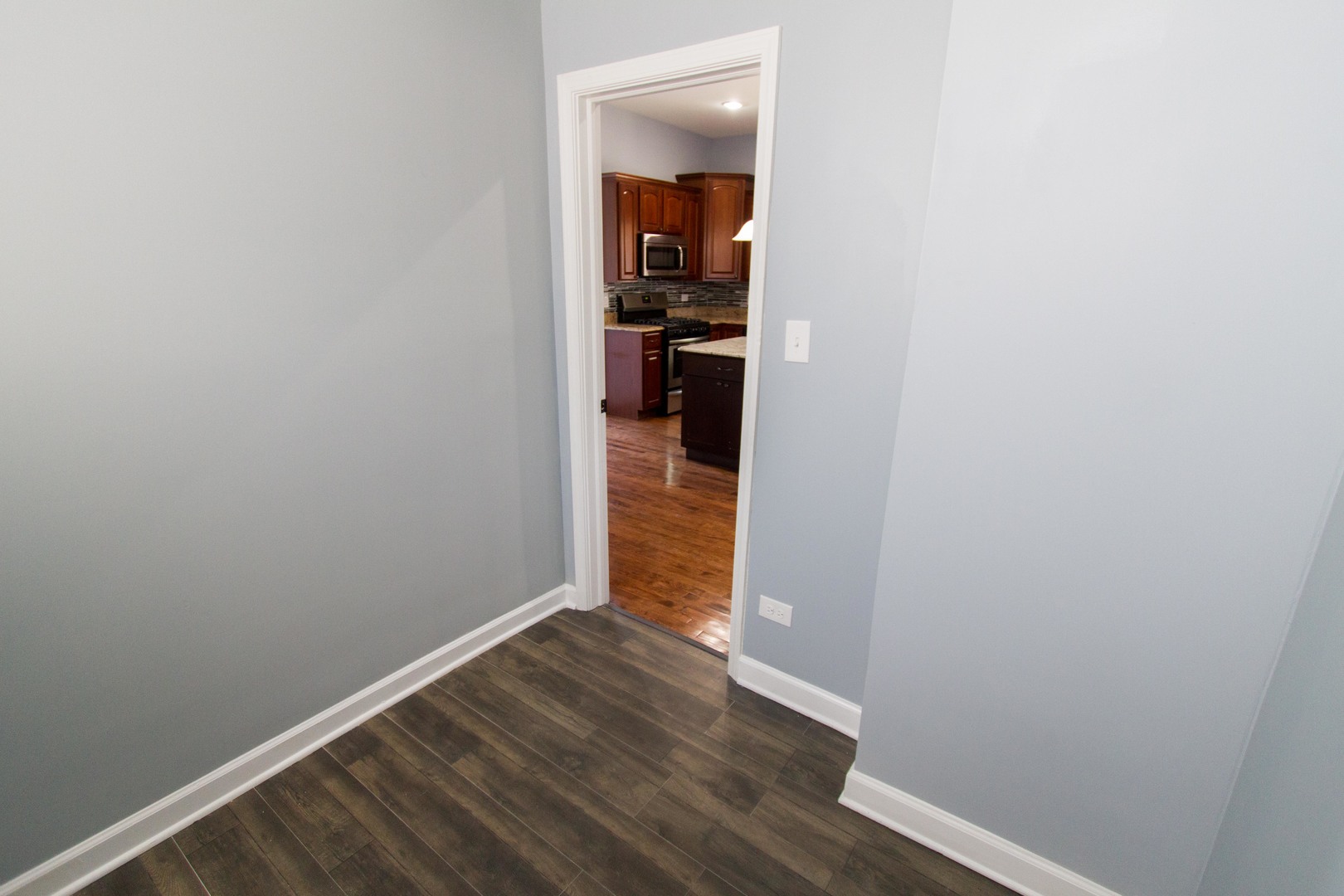 6519 28th Street Berwyn, IL 60402 - Photo 23 of 28 a view of a hallway with wooden floor