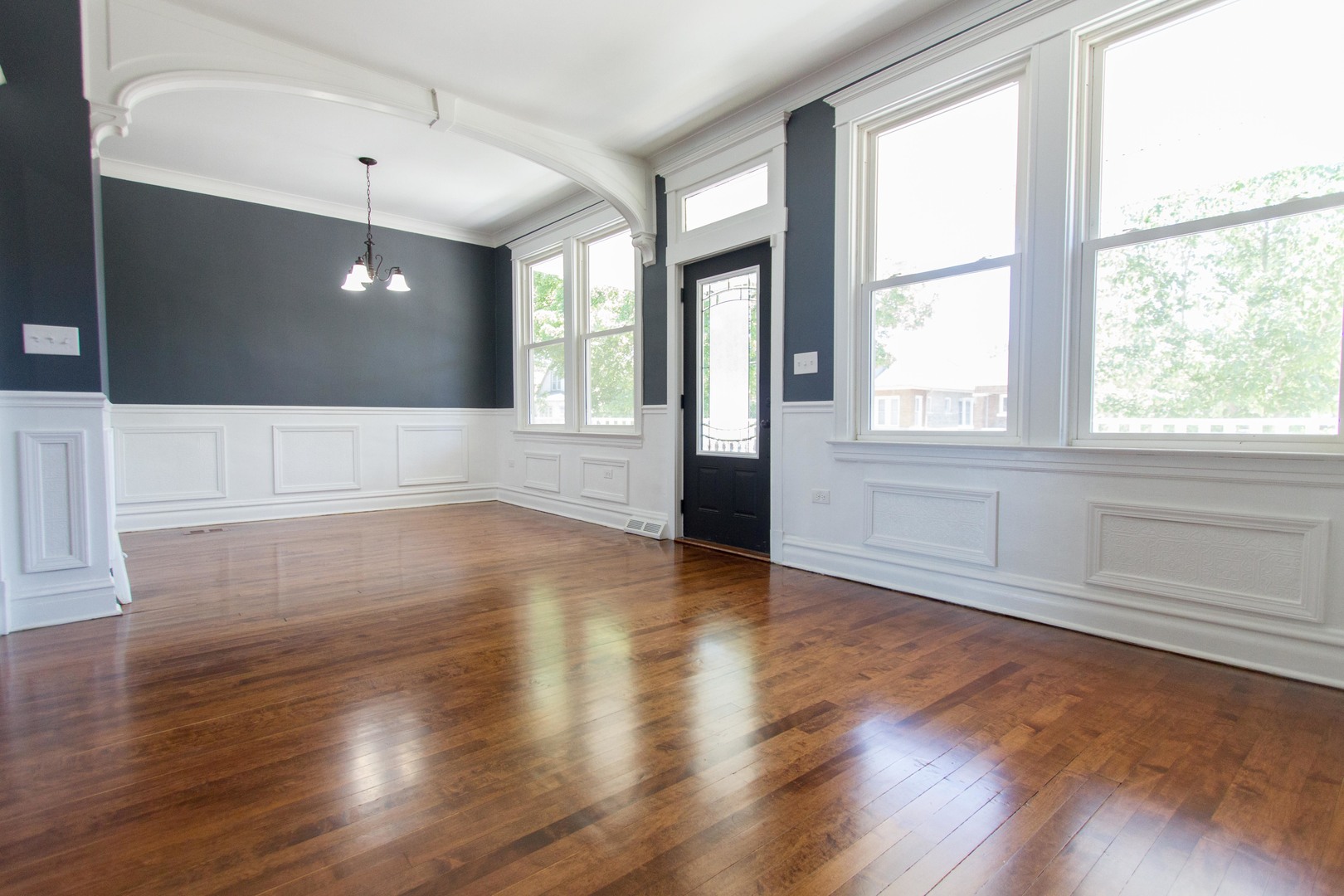 6519 28th Street Berwyn, IL 60402 - Photo 6 of 28 a view of an empty room with wooden floor and a window