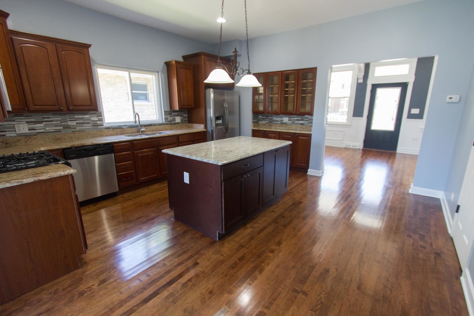 6519 28th Street Berwyn, IL 60402 - Photo 7 of 28 a kitchen with wooden floors and cabinets