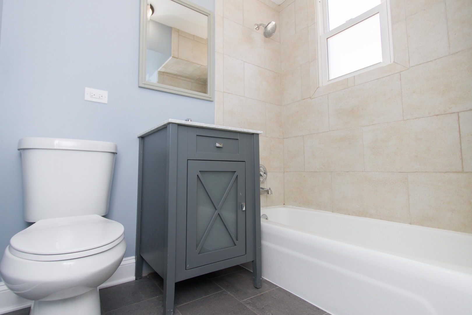 6519 28th Street Berwyn, IL 60402 - Photo 10 of 28 a bathroom with a toilet and a bathtub