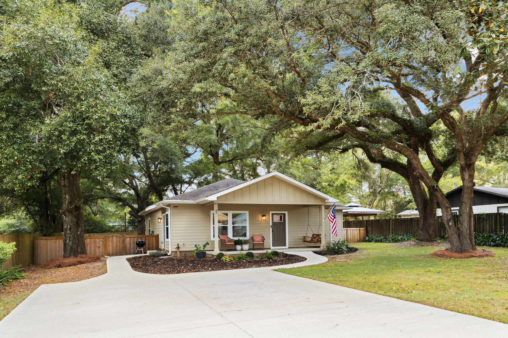 82 Live Oak Street Freeport, FL 32439 - Photo 1 of 22 a front view of a house with a yard