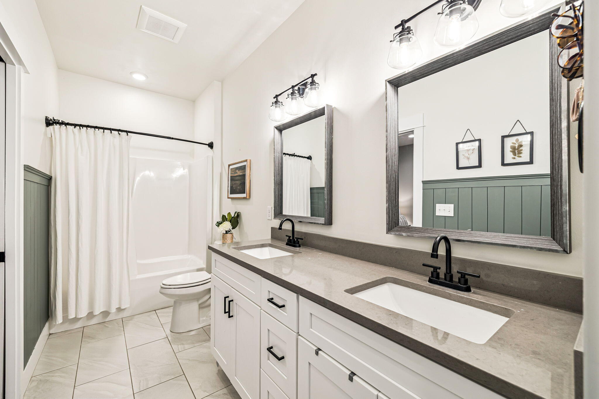82 Live Oak Street Freeport, FL 32439 - Photo 11 of 22 a bathroom with a double vanity sink and a mirror