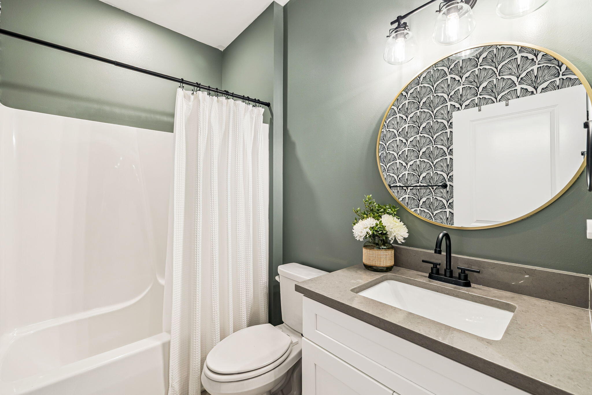 82 Live Oak Street Freeport, FL 32439 - Photo 14 of 22 a bathroom with a sink a toilet and shower