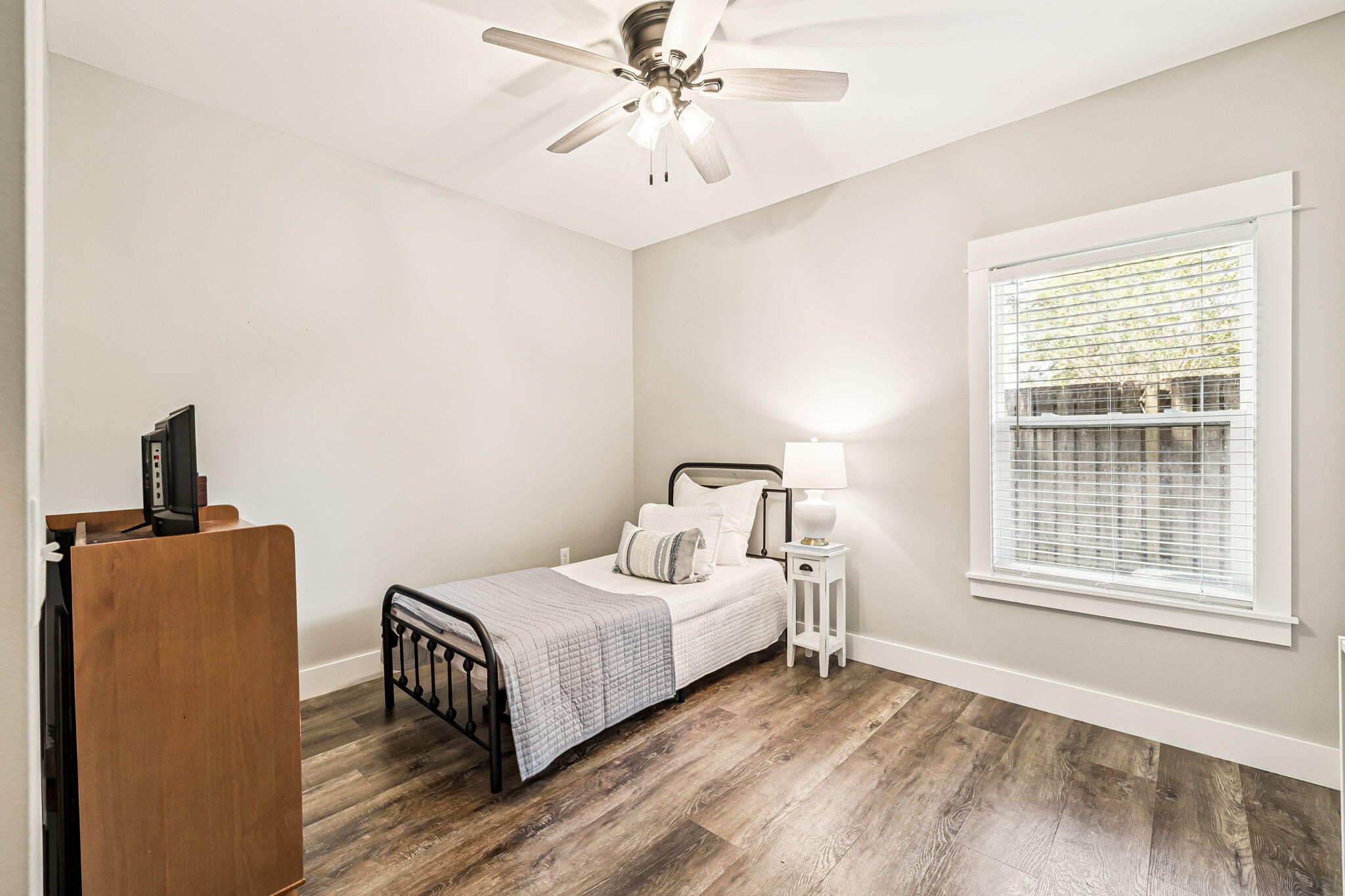 82 Live Oak Street Freeport, FL 32439 - Photo 15 of 22 a bedroom with a bed and a window