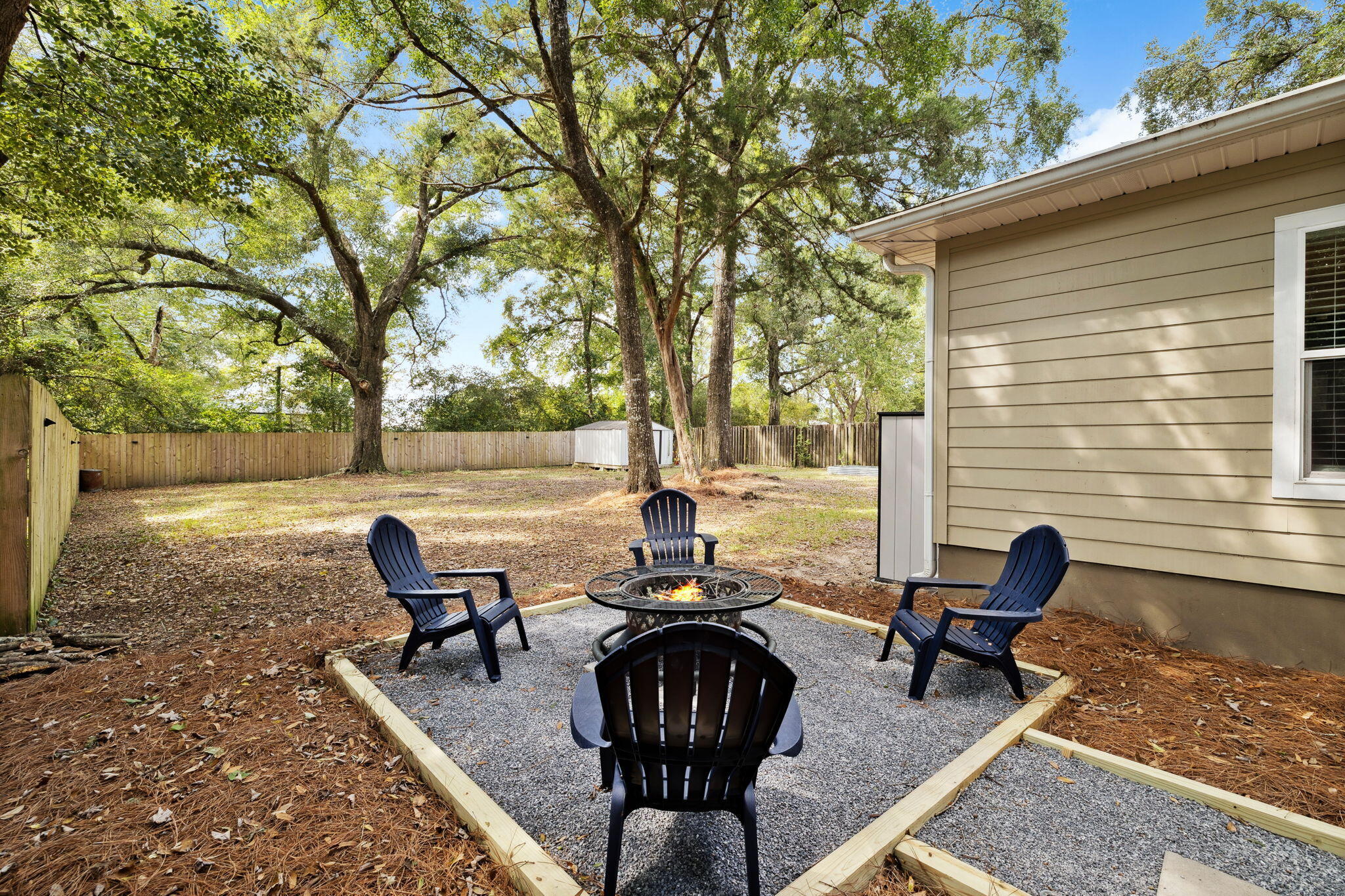 82 Live Oak Street Freeport, FL 32439 - Photo 17 of 22 a backyard view of a house with outdoor seating