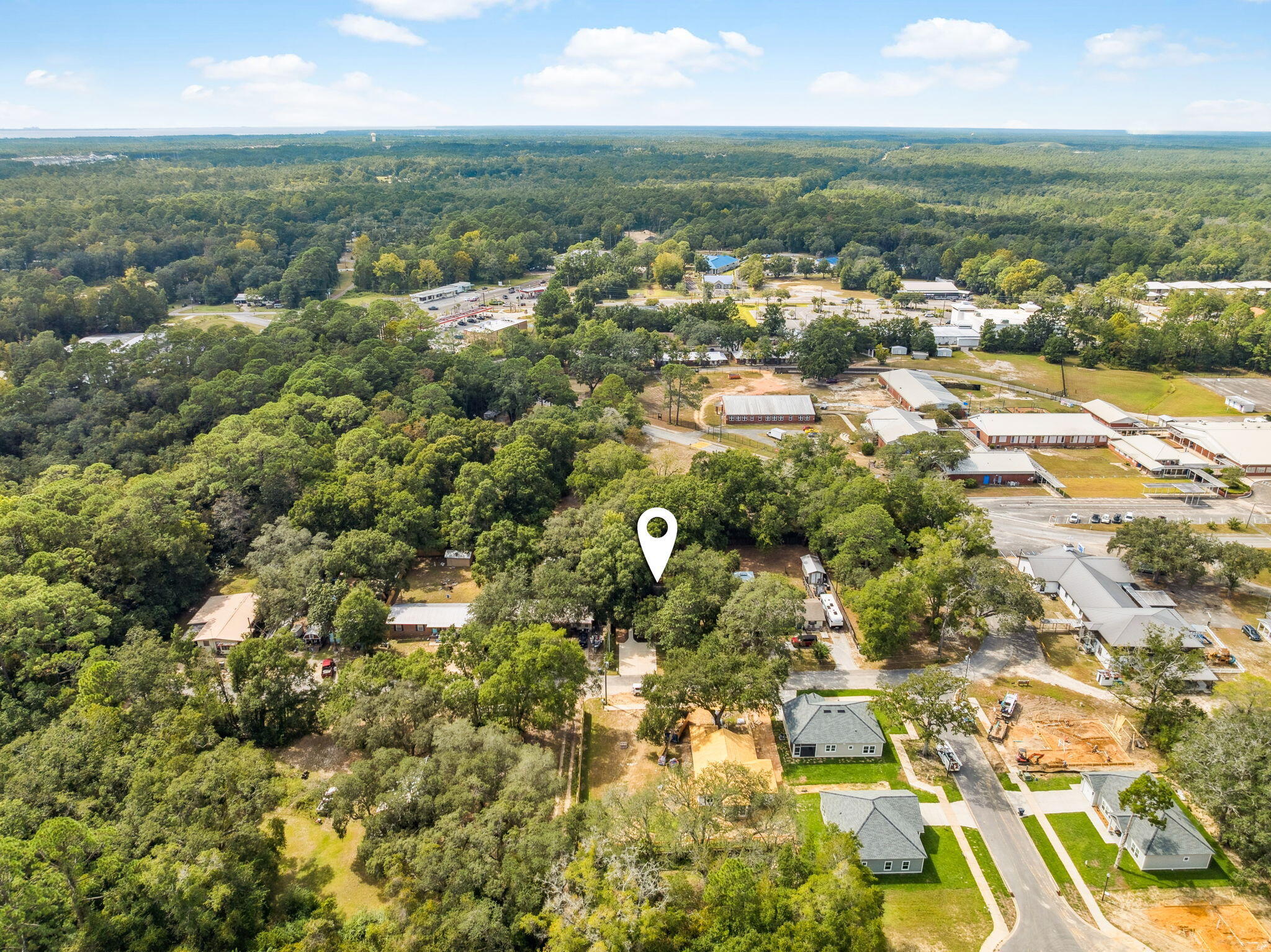 82 Live Oak Street Freeport, FL 32439 - Photo 22 of 22 an aerial view of residential houses with outdoor space and trees