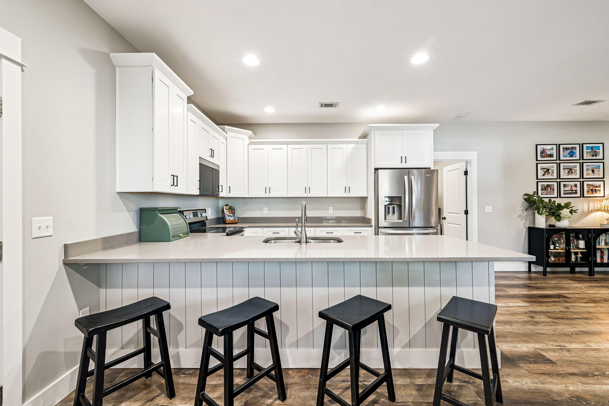 82 Live Oak Street Freeport, FL 32439 - Photo 5 of 22 a kitchen with stainless steel appliances granite countertop a table chairs sink and cabinets