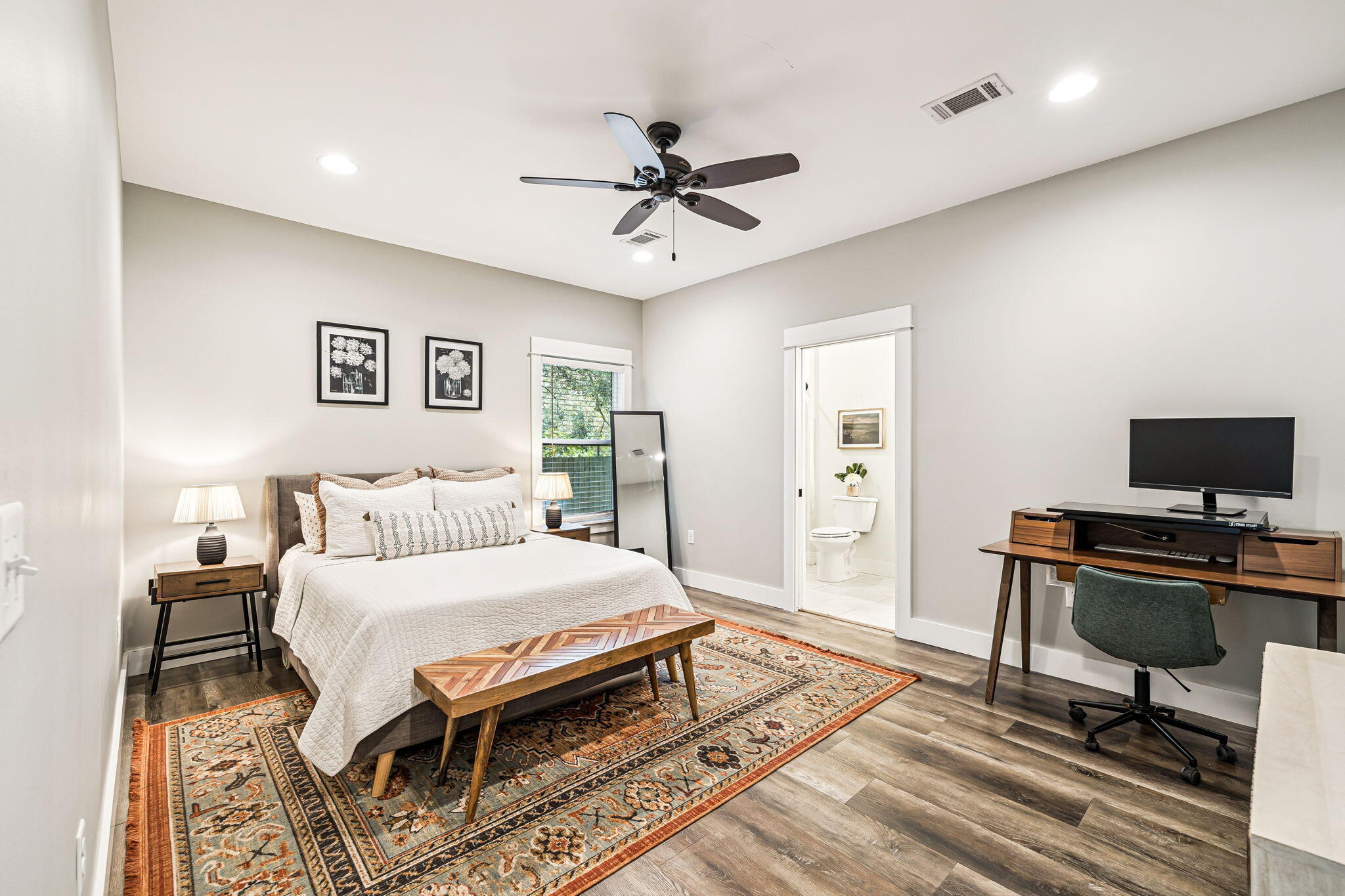 82 Live Oak Street Freeport, FL 32439 - Photo 10 of 22 a bedroom with a bed and a desk