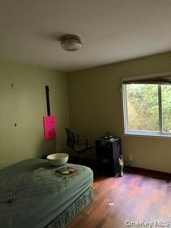 1117 Cedar Ridge Road Oyster Bay, NY 11771 - Photo 19 of 41 a bedroom with a bed and a window