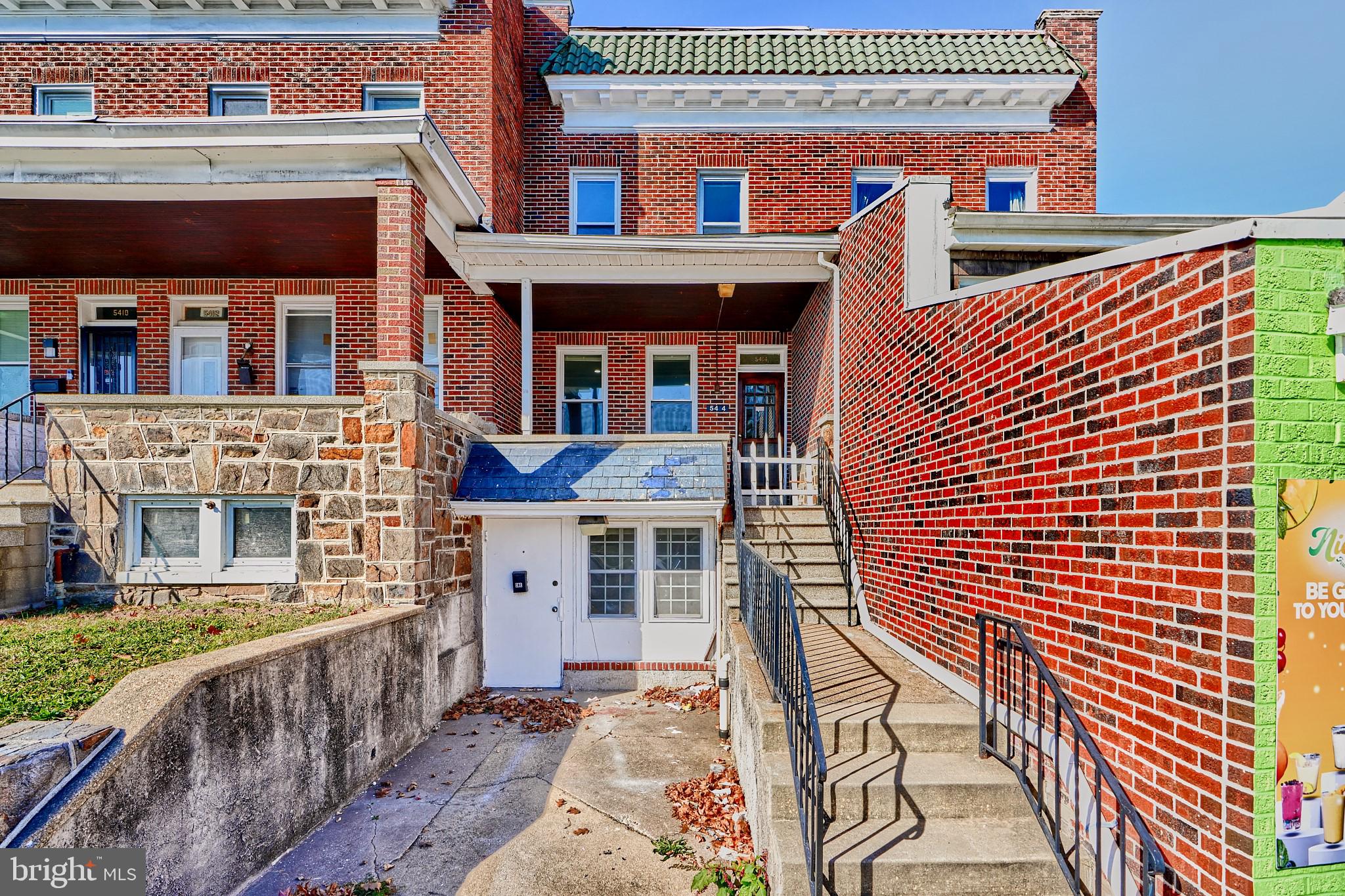 a front view of a house with large windows