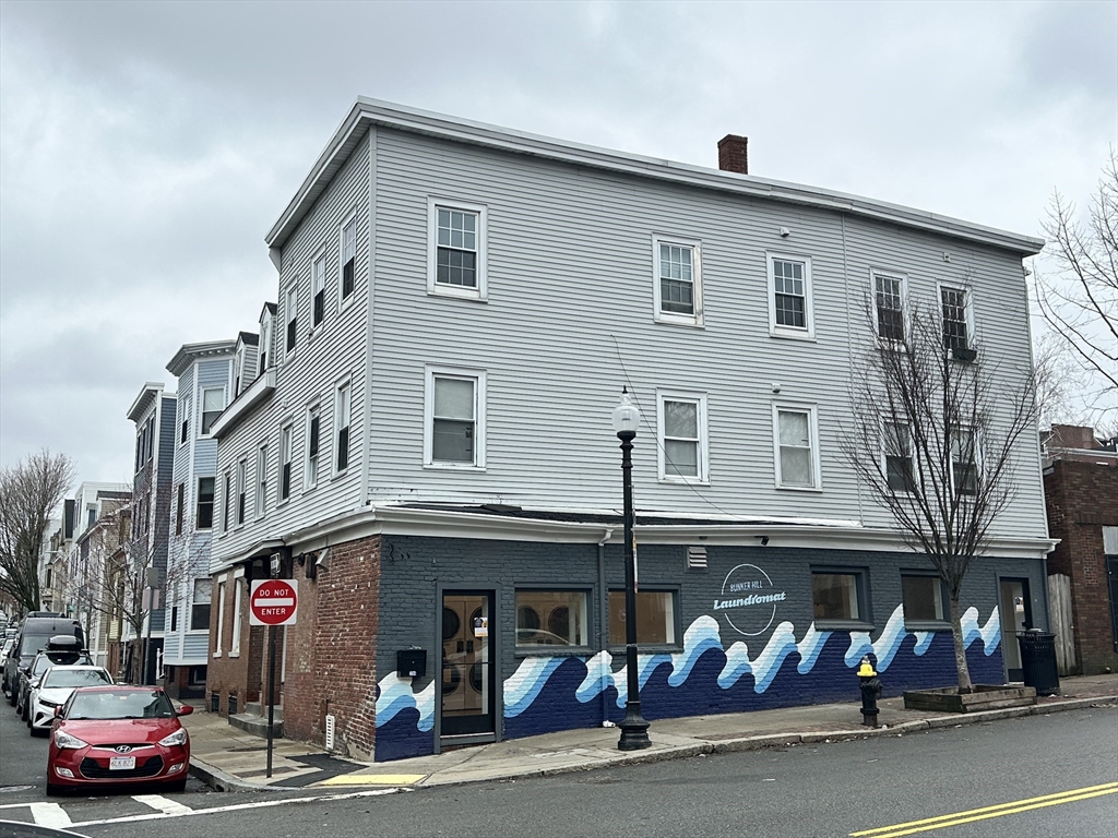 89 Green Street Boston, MA 02129 - Photo 2 of 2 a view of street with stores