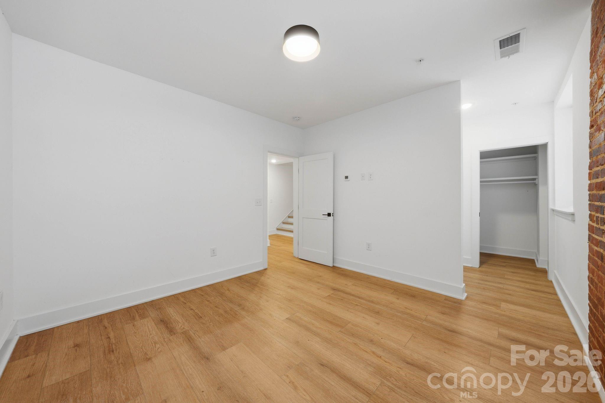 201 Grandin Road, Unit 9 Charlotte, NC 28208 - Photo 26 of 43 wooden floor in an empty room