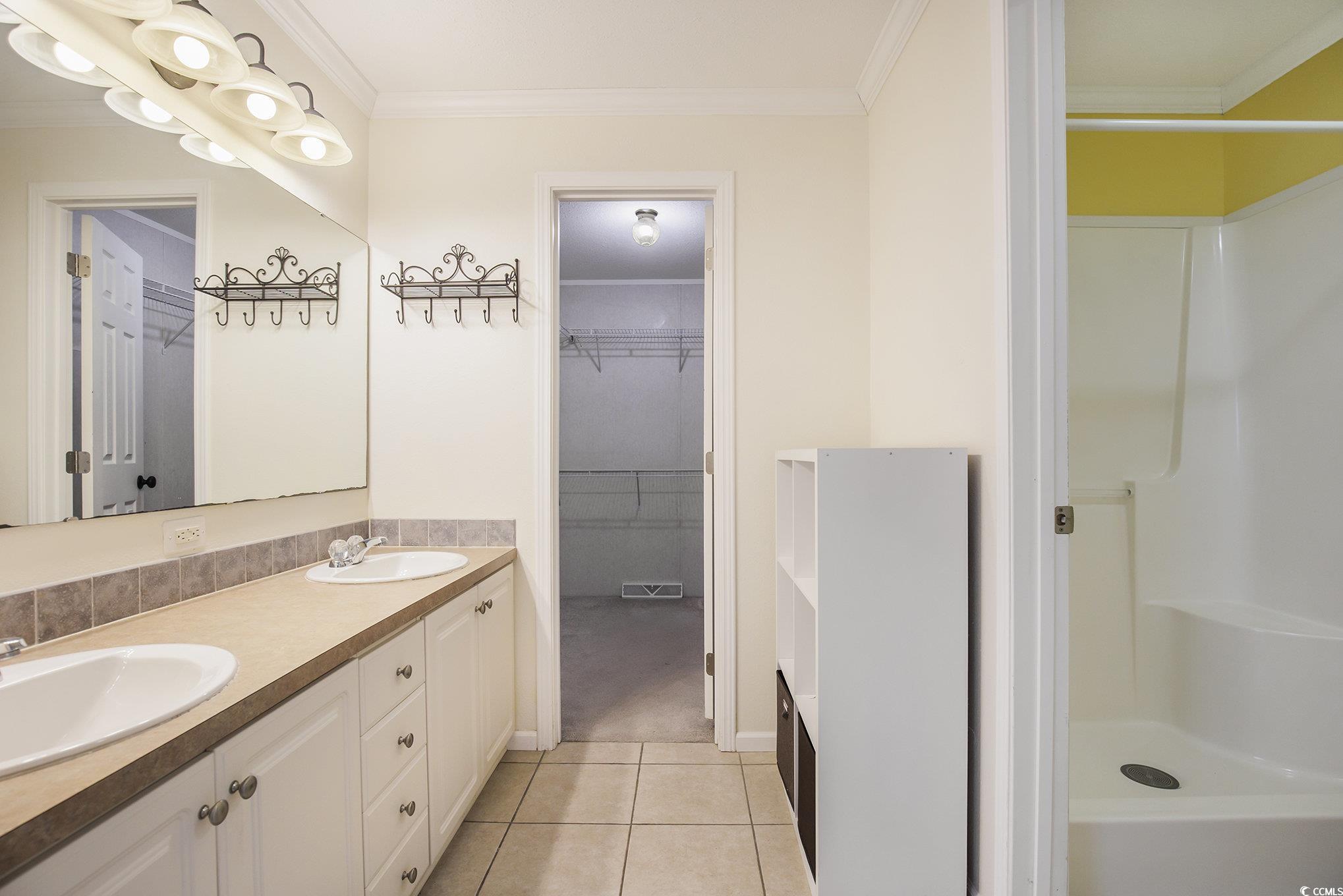 237 Wellspring Drive Conway, SC 29526 - Photo 17 of 33 Empty room featuring crown molding, light carpet, healthy amount of natural light, and ceiling fan