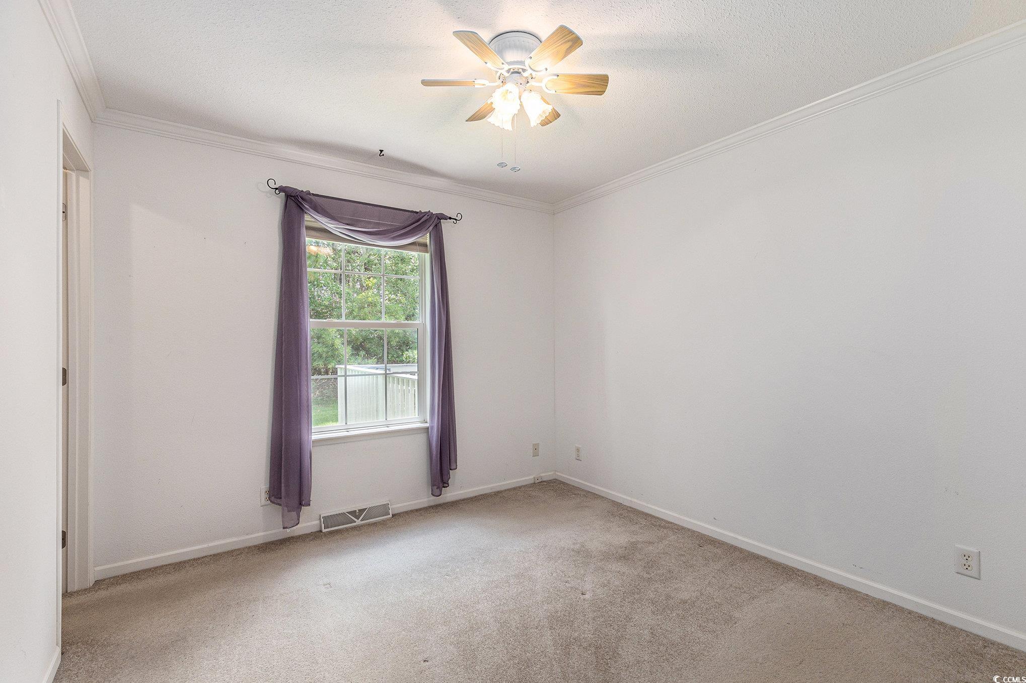 237 Wellspring Drive Conway, SC 29526 - Photo 20 of 33 Unfurnished bedroom with wood finished floors, ornamental molding, and ceiling fan