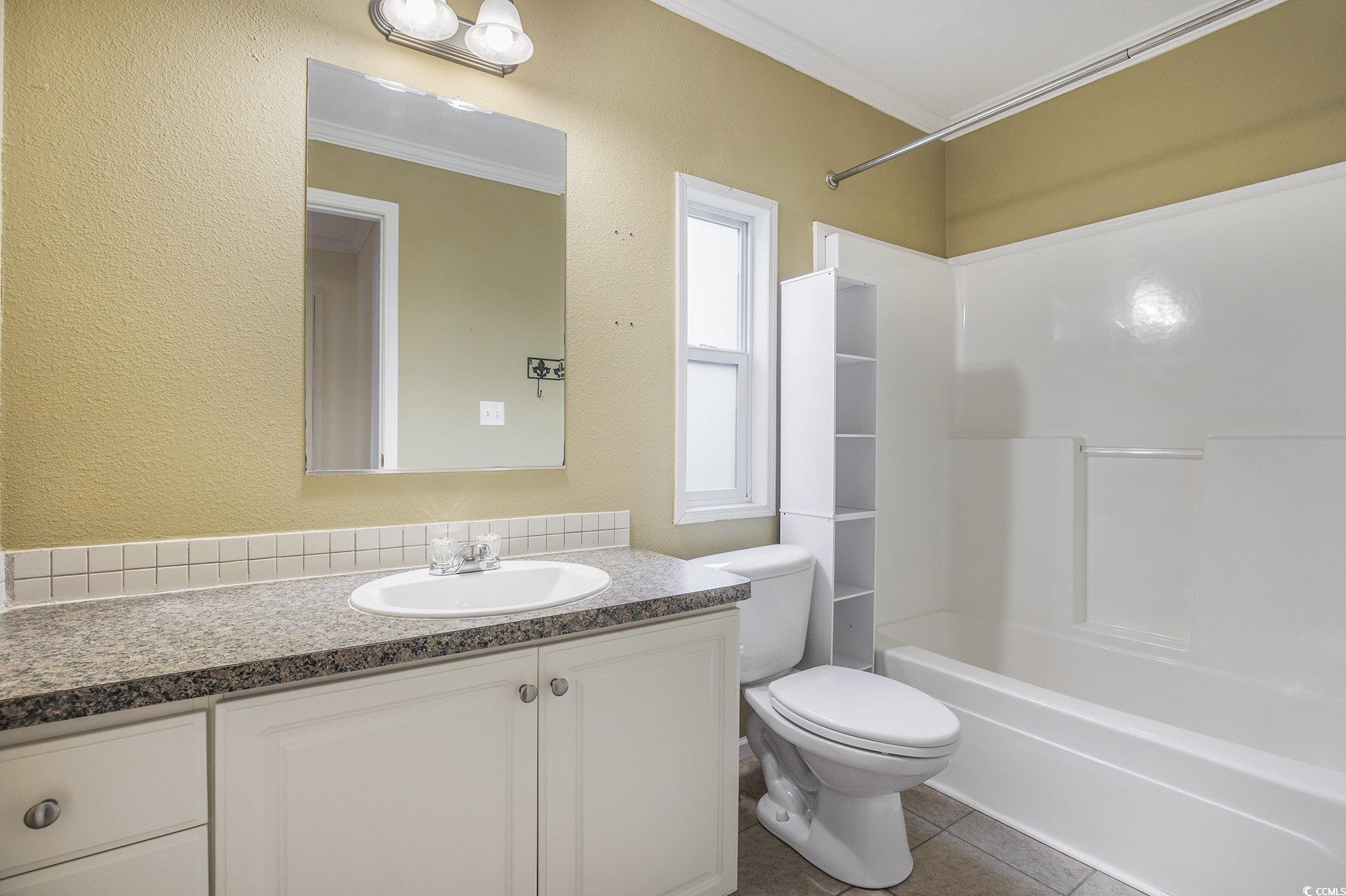 237 Wellspring Drive Conway, SC 29526 - Photo 21 of 33 Empty room with light colored carpet, crown molding, ceiling fan, and a textured ceiling