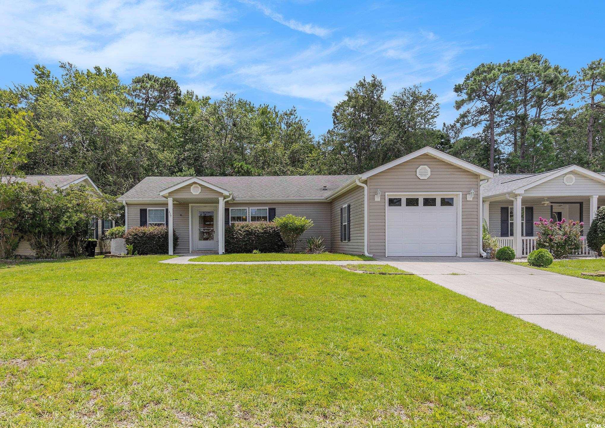 237 Wellspring Drive Conway, SC 29526 - Photo 24 of 34 Single story home featuring a garage, concrete driveway, and a front yard
