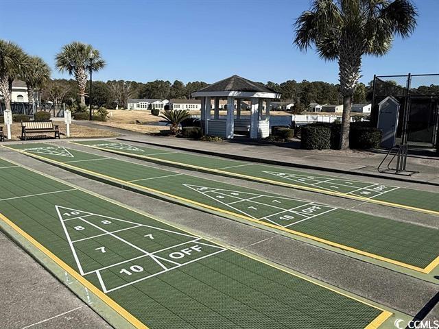 237 Wellspring Drive Conway, SC 29526 - Photo 30 of 33 Community bar area with a wainscoted wall, beamed ceiling, pool table, light wood finished floors, and coffered ceiling