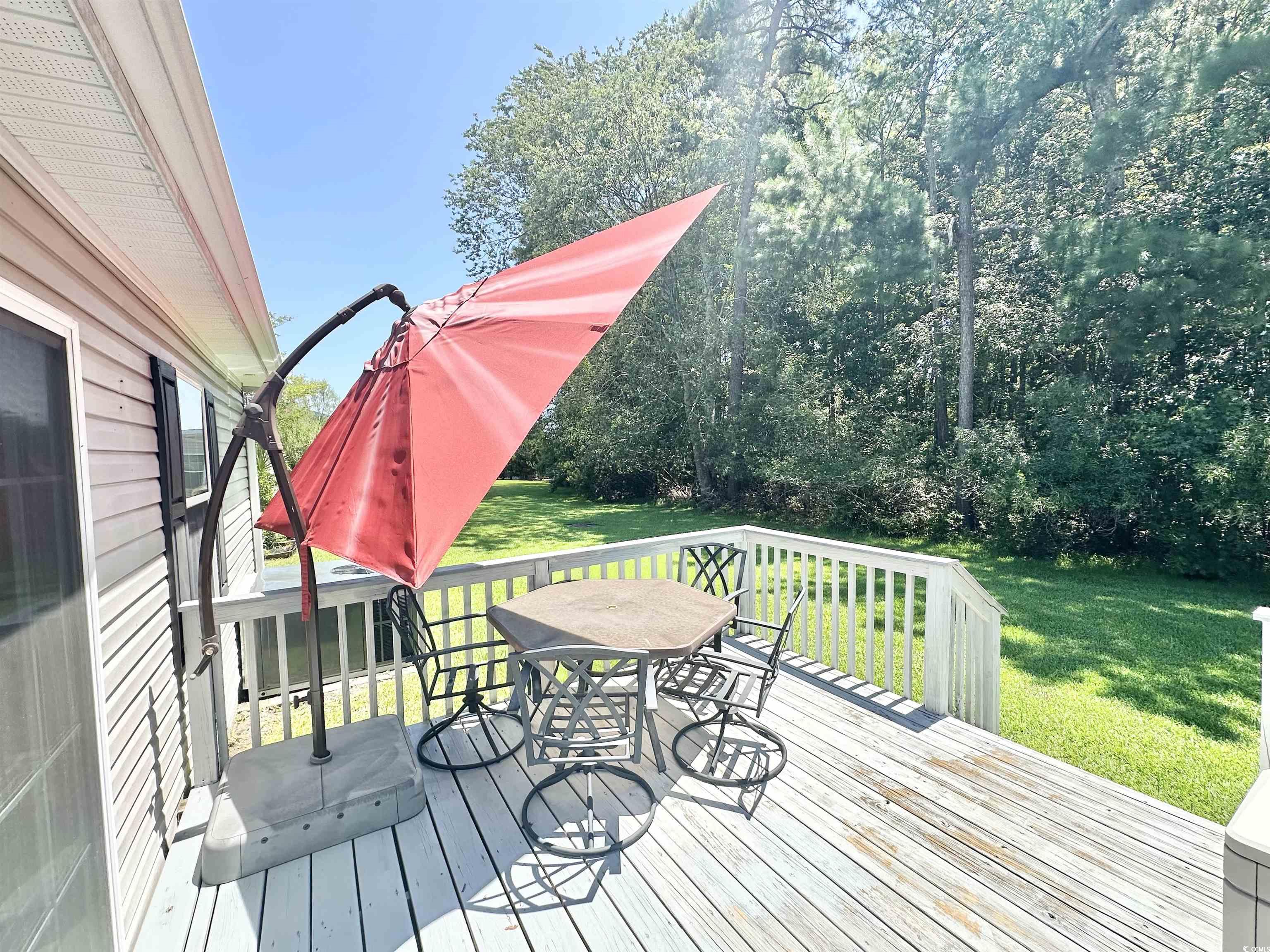 237 Wellspring Drive Conway, SC 29526 - Photo 5 of 34 Deck with outdoor dining space and a lawn