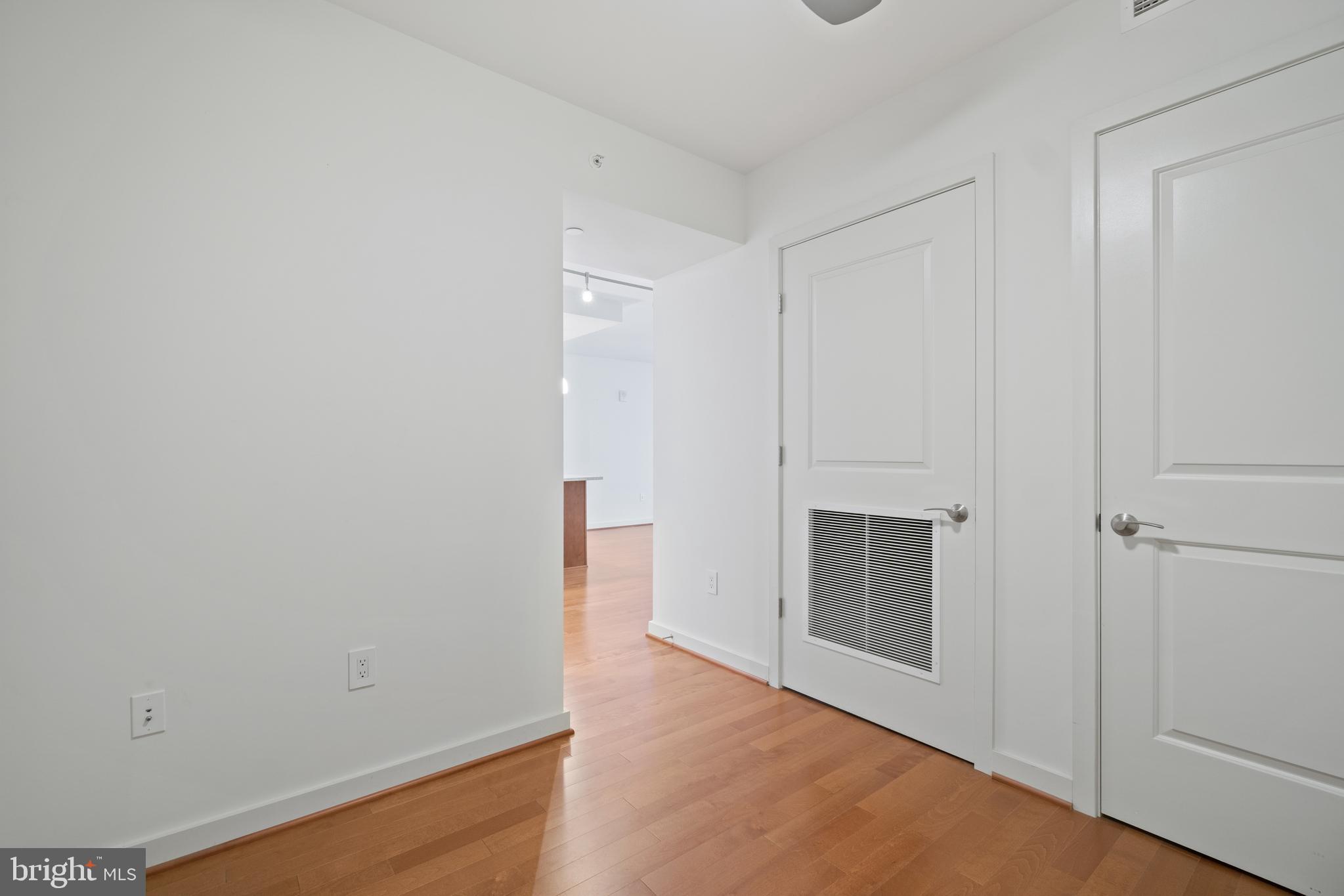 1025 First Street Southeast, Unit 801 Washington, DC 20003 - Photo 8 of 22 wooden floor in an empty room