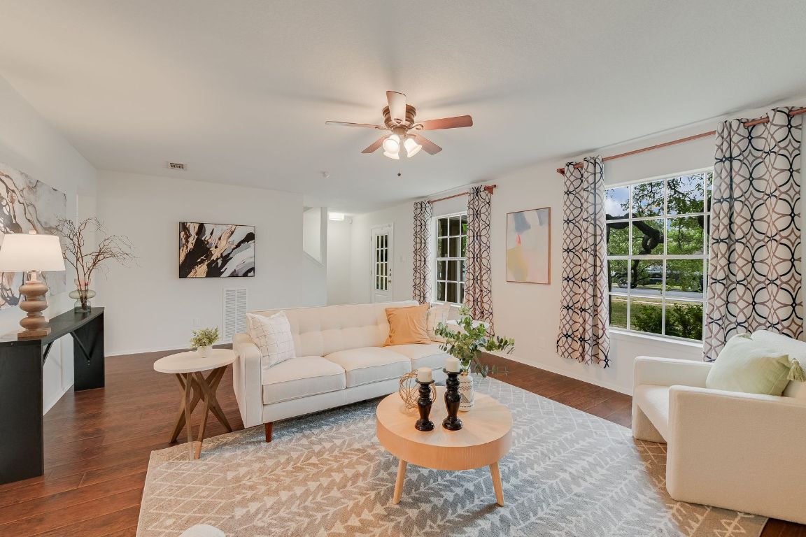 a living room with furniture and a large window