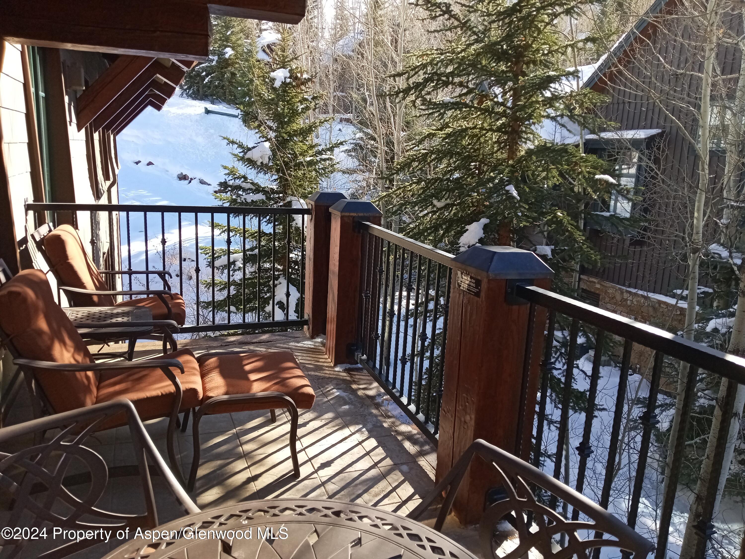 75 Prospector Road, Unit 8306 WINTER INTEREST 1 Aspen, CO 81611 - Photo 15 of 21 a view of a balcony with chairs