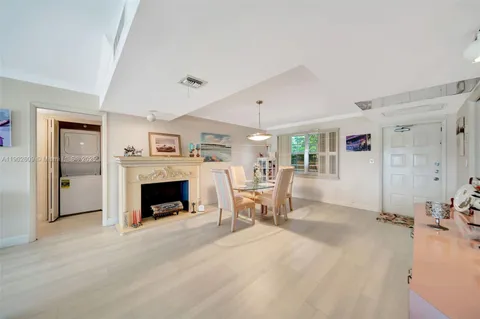 a living room with furniture rug and lamp
