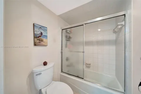 a view of a hallway with entryway and furniture