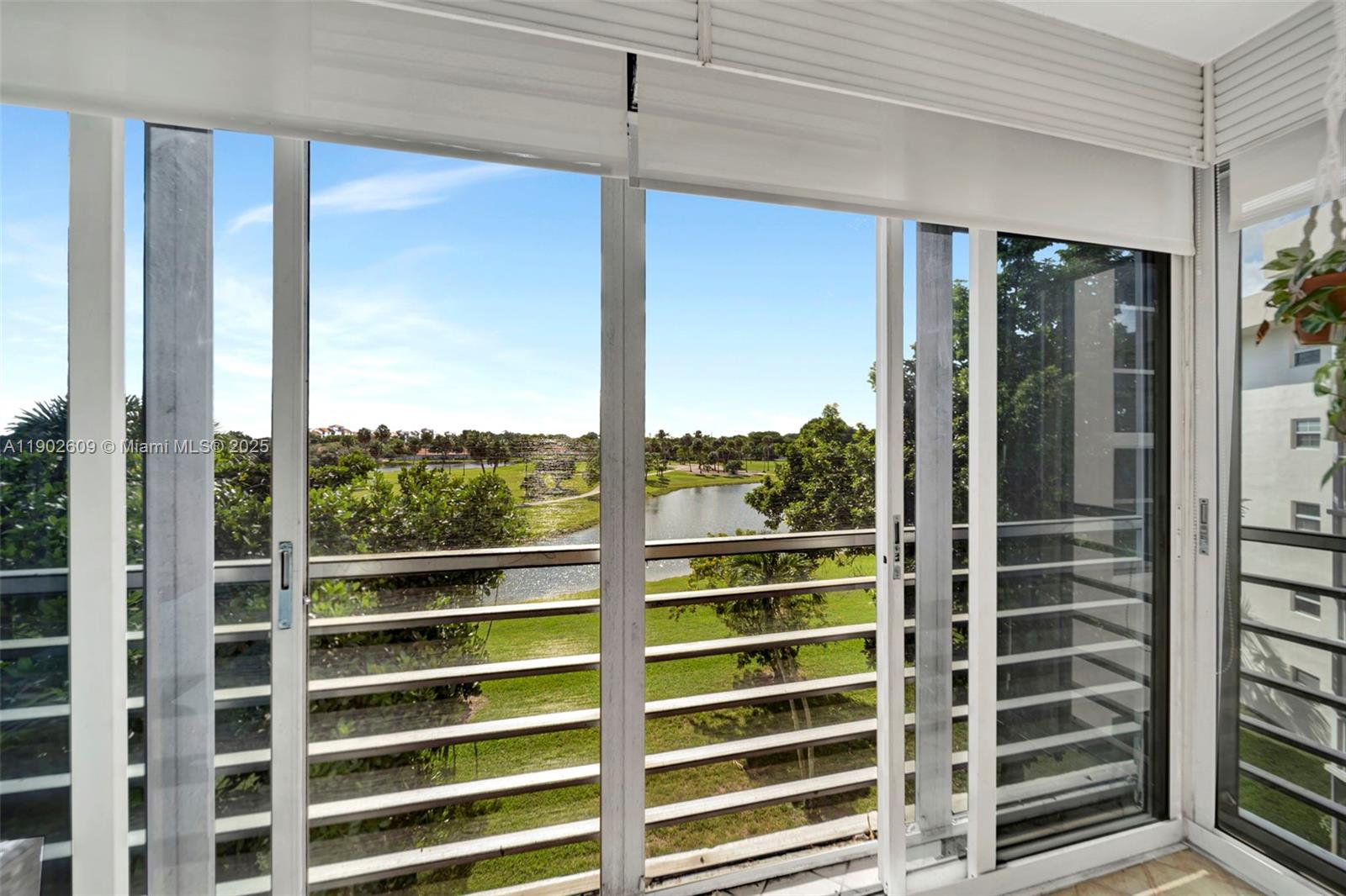 3980 Oaks Clubhouse Drive, Unit 409 Pompano Beach, FL 33069 - Photo 38 of 70 a view of a city from a windows