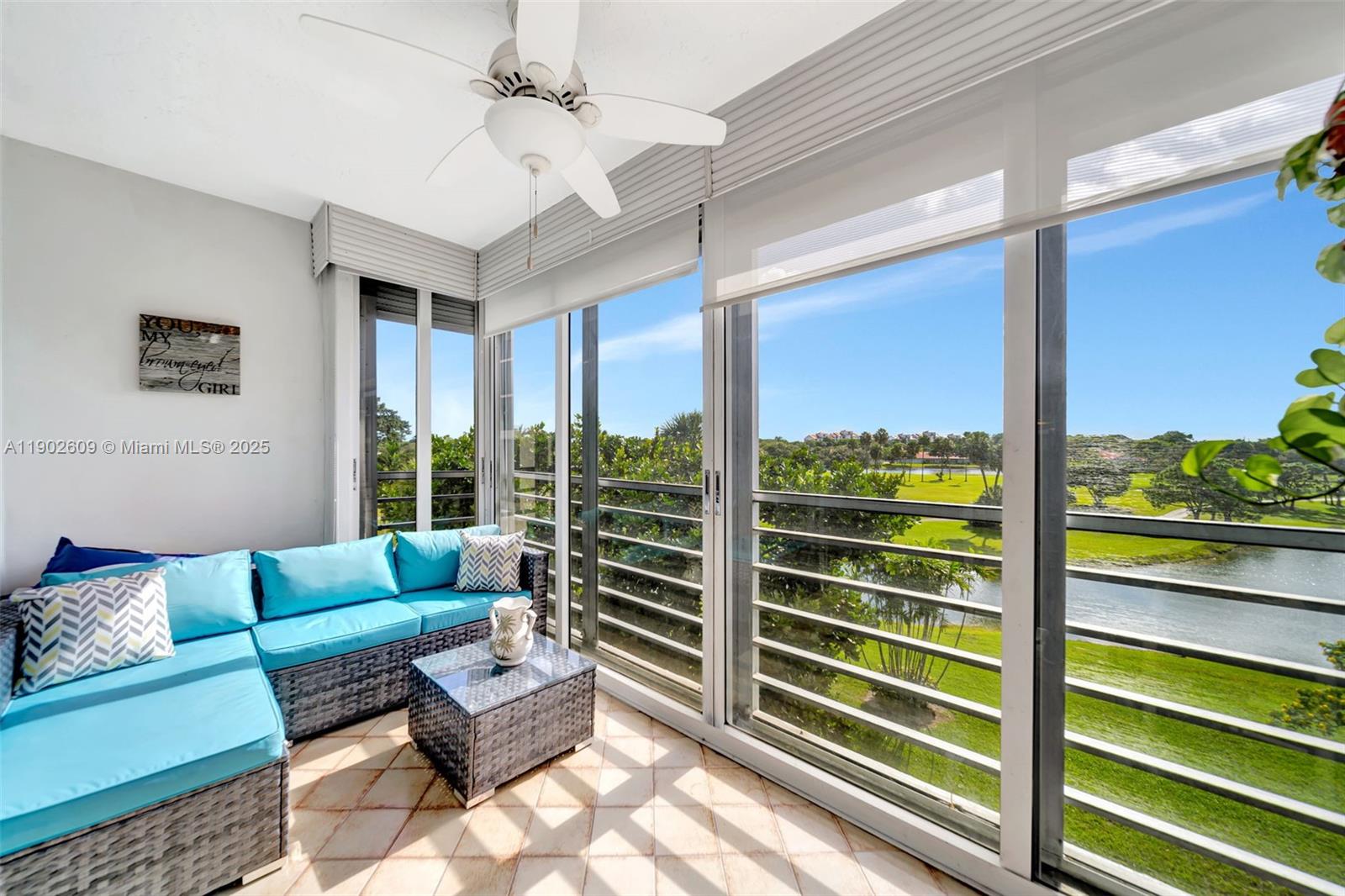 3980 Oaks Clubhouse Drive, Unit 409 Pompano Beach, FL 33069 - Photo 42 of 70 a living room with furniture and a large window
