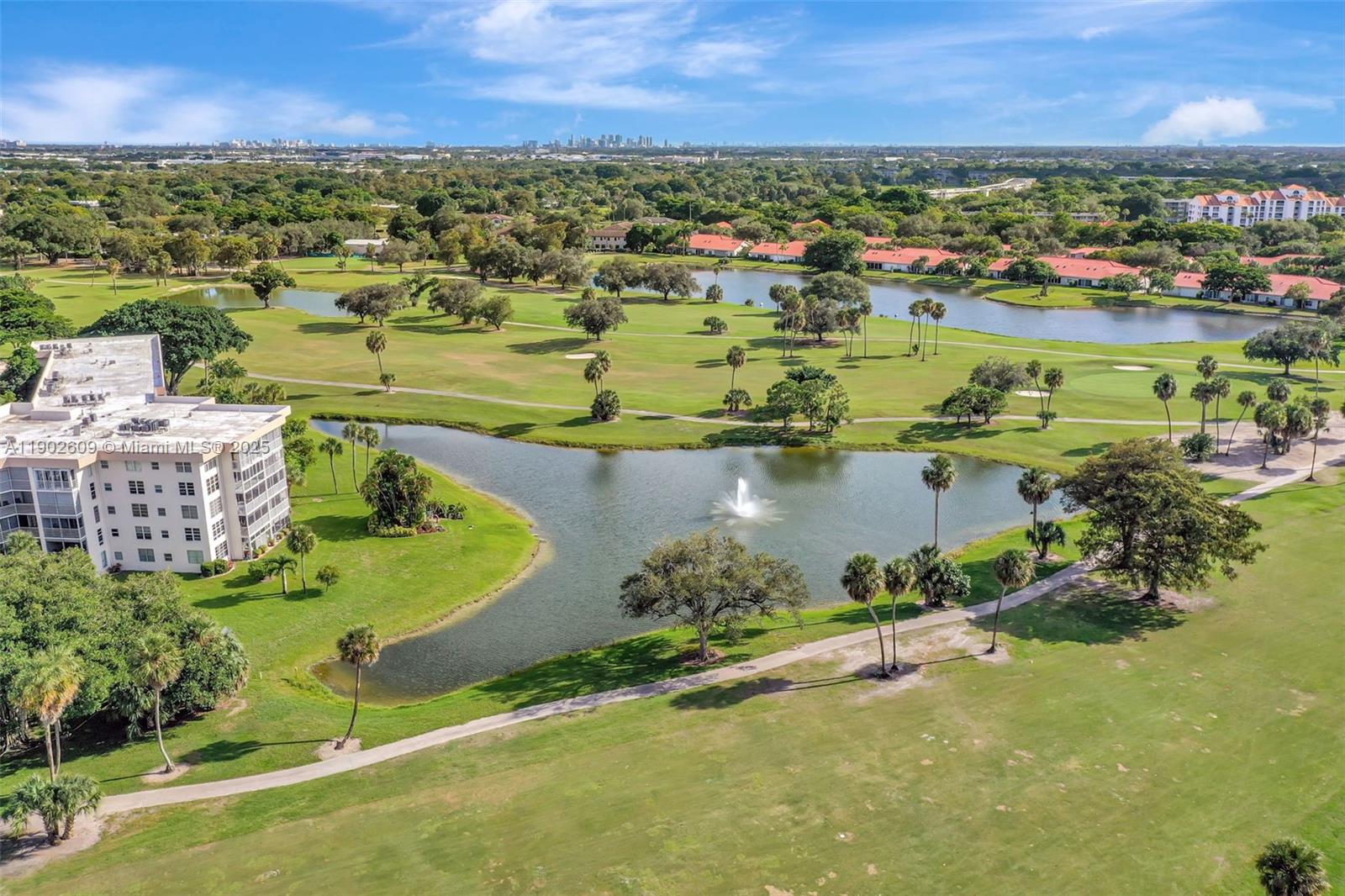 3980 Oaks Clubhouse Drive, Unit 409 Pompano Beach, FL 33069 - Photo 59 of 70 an aerial view of a house with a garden