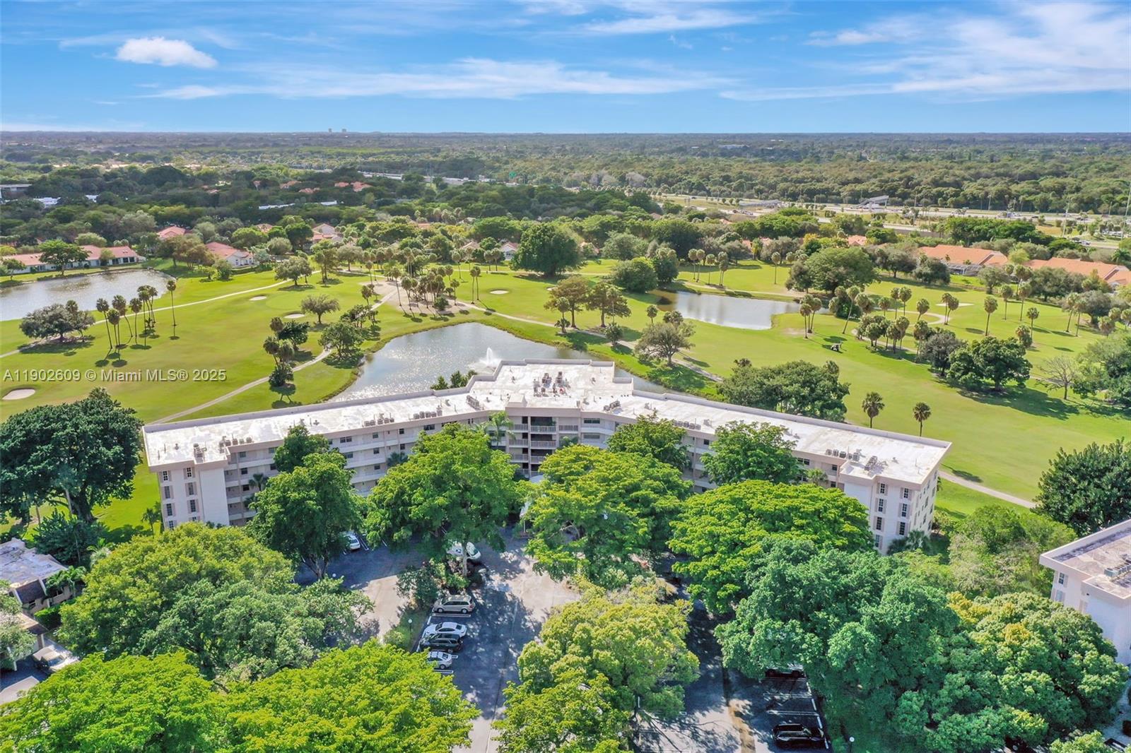 3980 Oaks Clubhouse Drive, Unit 409 Pompano Beach, FL 33069 - Photo 67 of 70 an aerial view of residential houses with outdoor space and ocean view