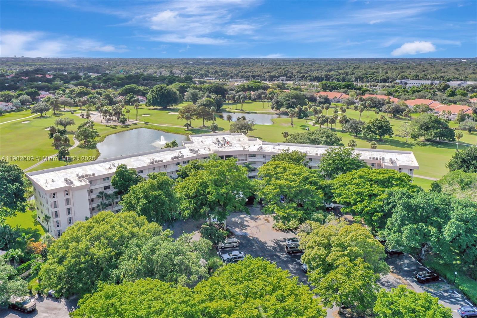3980 Oaks Clubhouse Drive, Unit 409 Pompano Beach, FL 33069 - Photo 68 of 70 a view of a city with lake view