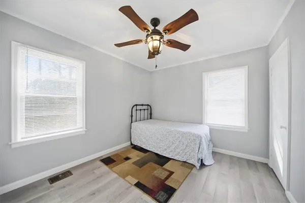 a bedroom with a bed and window