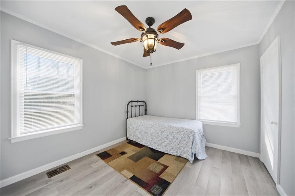 2363 Woodside Way Atlanta, GA 30341 - Photo 15 of 30 a bedroom with a bed and window