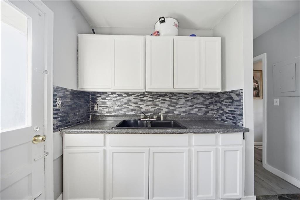 2363 Woodside Way Atlanta, GA 30341 - Photo 22 of 30 a view of a refrigerator and cabinets