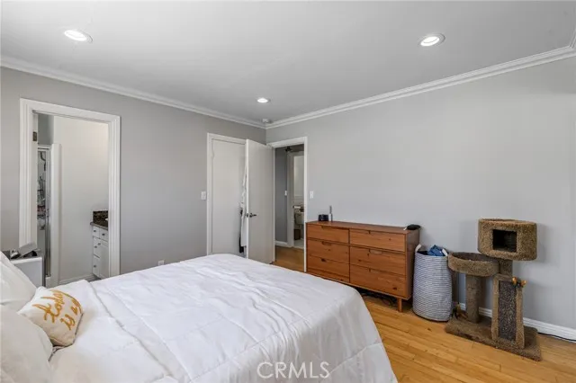 209 13th Street, Unit D Huntington Beach, CA 92648 - Photo 16 of 34 a bedroom with a bed and a television