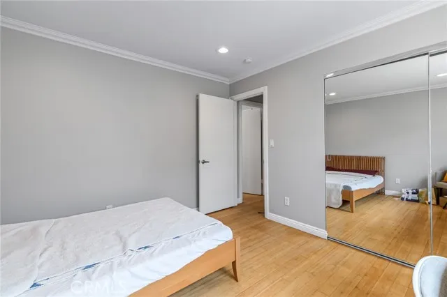 209 13th Street, Unit D Huntington Beach, CA 92648 - Photo 20 of 34 a bedroom with a bed and furniture