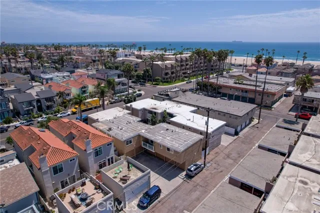 209 13th Street, Unit D Huntington Beach, CA 92648 - Photo 27 of 34 an aerial view of a multi story parking space with city view