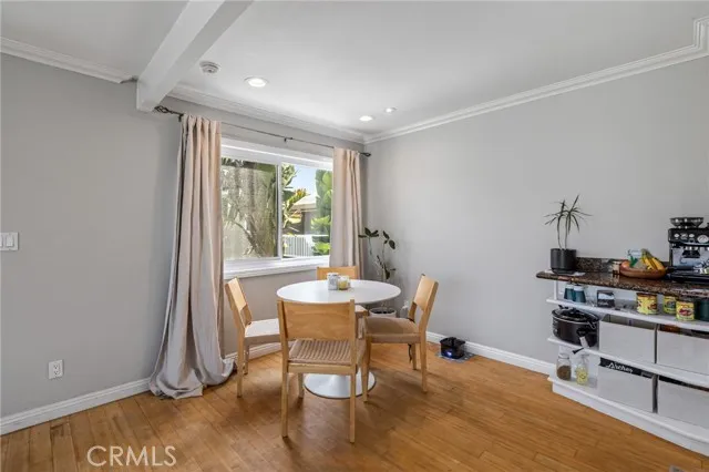 209 13th Street, Unit D Huntington Beach, CA 92648 - Photo 10 of 34 a workspace with furniture and a window