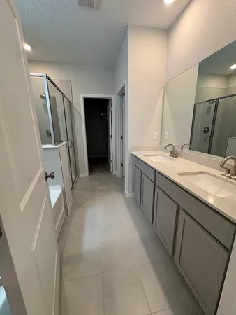 a bathroom with a sink and mirror